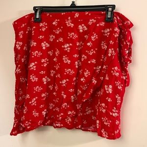 Red and white above knee elastic waist faux wrap skirt.